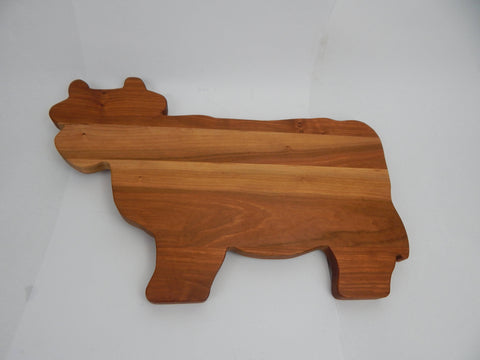 Cow shaped cutting boards.
